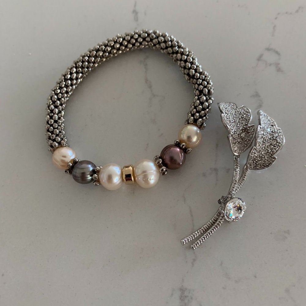 Elastic silver colored bracelet w/ rhinestone pin